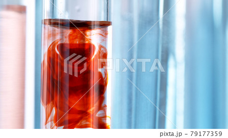 Drawing blood into syringe. Macro shot medical procedure. 79177359