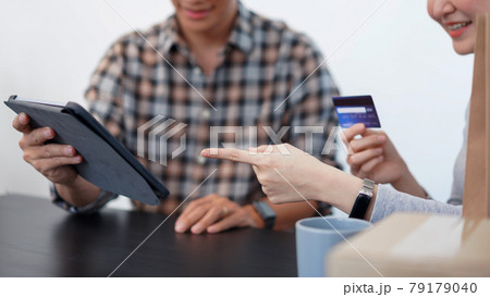 Shopping online concept a lovely couple adding credit card information to use in online financial transaction 79179040