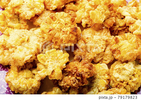 Chrysanthemum flowers roasted in batter,food background Chrysanthemum flowers roasted in batter,food background 79179823