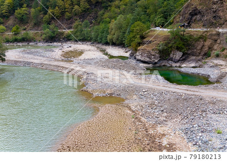 Drought-cracked land on the banks of the mountain river Chorokh. 79180213
