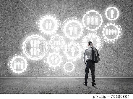 Cogwheel engine drawn on concrete wall as symbol for teamwork an Cogwheel engine drawn on concrete wall as symbol for teamwork an 79180304