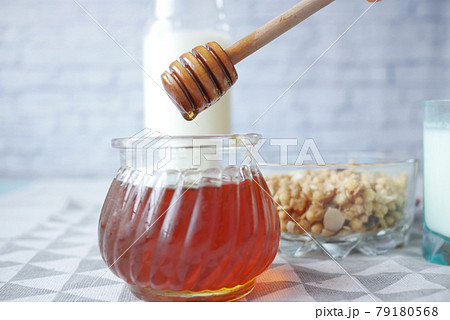 close up of fresh honey with spoon on table close up of fresh honey with spoon on table 79180568