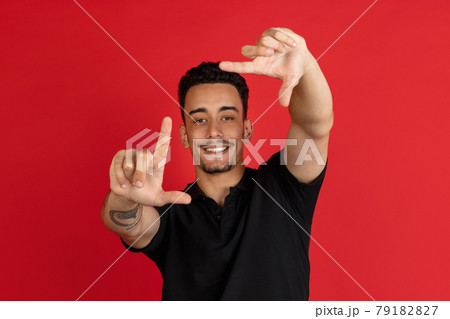 young male portrait isolated over studio background with copyspace 79182827