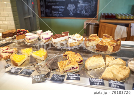Various desserts, cut into segments - currant cake, cheesecake, sacher, grated raspberry cake, royal cheesecake, pear pie Various desserts, cut into segments - currant cake, cheesecake, sacher, grated raspberry cake, royal cheesecake, pear pie 79183726