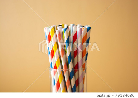Colorful paper straws. Event and party supplies. Biodegradable straws, pollution concept. Zero waste. 79184036