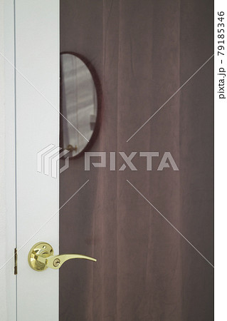 Golden handles on a glass door Golden handles on a glass door 79185346