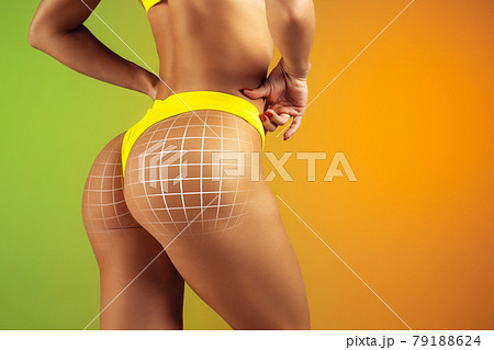 Woman's buttocks with arrows isolated on gradient yellow green background. Back view Woman's buttocks with arrows isolated on gradient yellow green background. Back view 79188624