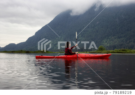 Adventure Caucasian Adult Woman Kayaking in Red Kayak 79189219