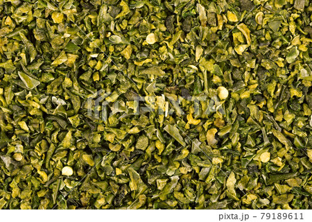 Dried green paprika flakes with seeds background. Chopped jalapeno, habanero or chilli pepper. Spices and herbs. Dried green paprika flakes with seeds background. Chopped jalapeno, habanero or chilli pepper. Spices and herbs. 79189611
