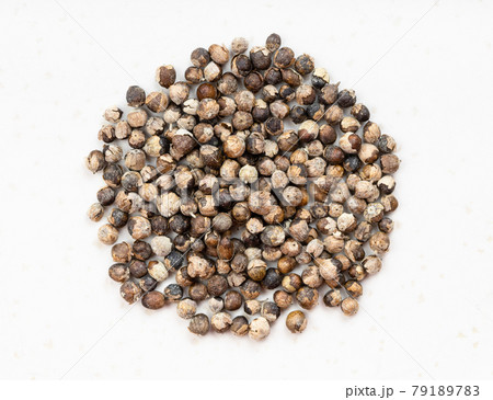 pile of monk's pepper (vitex) close up on gray 79189783