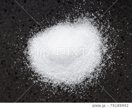pile of crystalline erythritol sugar on black 79189992