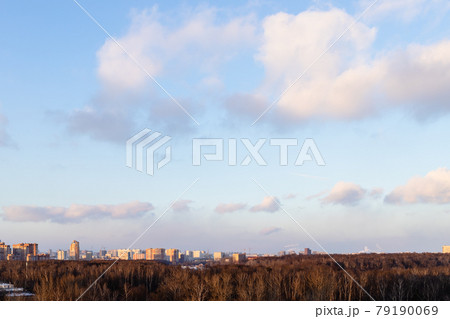 sunset sky with clouds over city park and houses sunset sky with clouds over city park and houses 79190069