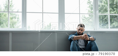 Man feeling sad, tired and worried, suffering depression in mental health, problems and broken heart 79190370