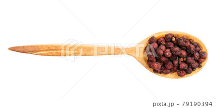 top view of wood spoon with dried schisandra top view of wood spoon with dried schisandra 79190394