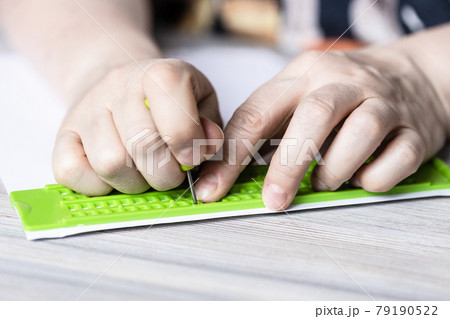 front view of printing in braille with slate 79190522