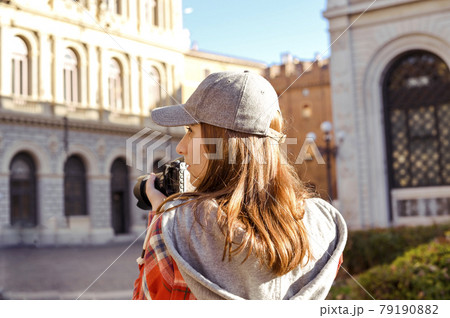 Woman traveling and taking pictures outdoors. Photographer Traveling Attractions Walk Hobby 79190882