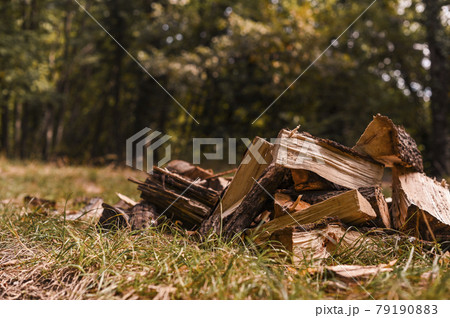 Chopped firewood for the fireplace. Autumn atmosphere in the mountains. 79190883