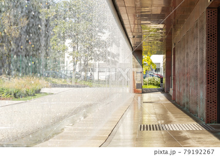 Decorative water-wall in the building exterior Decorative water-wall in the building exterior 79192267