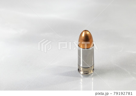 close up bullet 9mm parabellum FMJ (Full Metal Jacket ) on reflection surface. 79192781