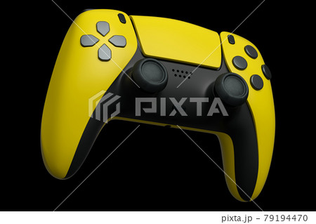 Realistic yellow joystick for video game controller on black background 79194470
