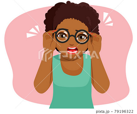 Cute young afro woman tries seeing with glasses bad vision concept 79196322