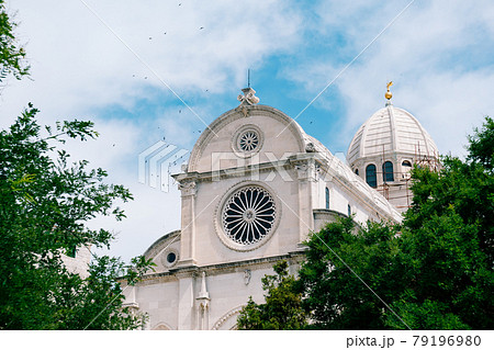 View of the Cathedral of St. James in Sibenik, Croatia against the background of blue sky and green trees View of the Cathedral of St. James in Sibenik, Croatia against the background of blue sky and green trees 79196980