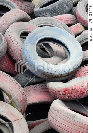 A picture of many old used tires left on a waste dump 79201416