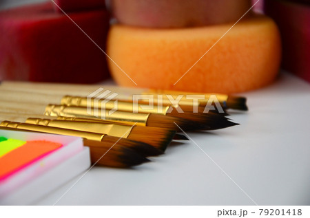 Color cosmetics, brushes and sponges for face painting on white background 79201418