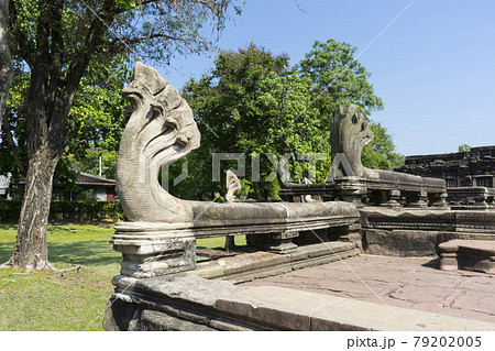 Seven Headed Naga Sculptures under Vivid Blue Sky at the Entrance of Phimai Historical Park in Nakhon Ratchasima, Thailand. 79202005