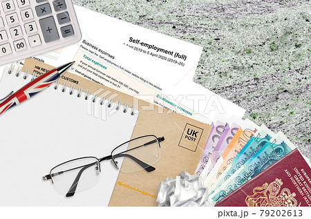 English Tax form sa103 Self-employment from HM revenue and customs lies on table with office items. HMRC paperwork and tax paying process in United Kingdom English Tax form sa103 Self-employment from HM revenue and customs lies on table with office items. HMRC paperwork and tax paying process in United Kingdom 79202613