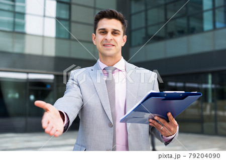 Successful businessman ready for handshake 79204090