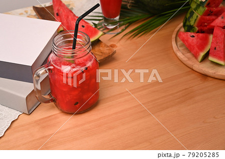 Watermelon smoothie on wooden table. 79205285