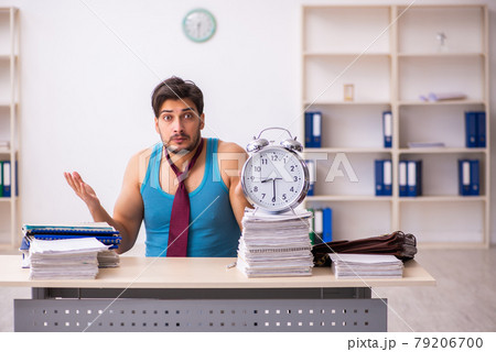 Young male employee coming to work straight from bed 79206700