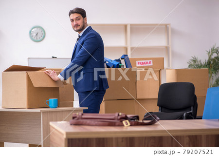 Young male employee in relocation concept 79207521