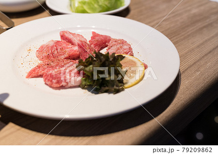 Raw beef in Japanese restaurant. This restaurant specializes in grilled meat. 79209862