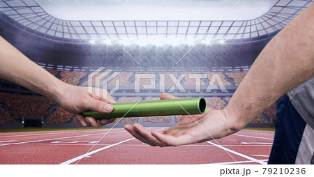 Composition of male runner passing baton to his teammate 79210236