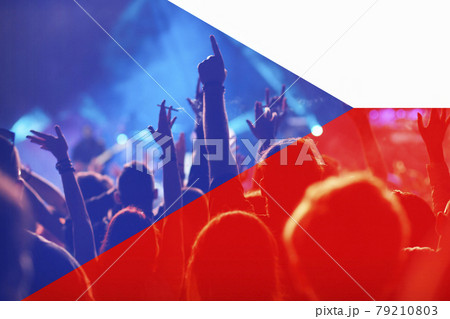 football fans supporting Czech Republic - crowd celebrating in stadium with raised hands against Czech Republic flag 79210803