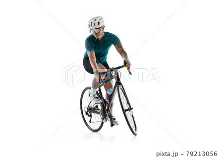 Young professional female bike rider on road bike isolated over white background. Young professional female bike rider on road bike isolated over white background. 79213056