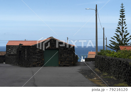 Lajido village Pico Island Azores black lava houses red windows 79216120