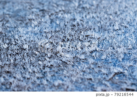 White hoarfrost crystals on flat surface close-up view White hoarfrost crystals on flat surface close-up view 79216544