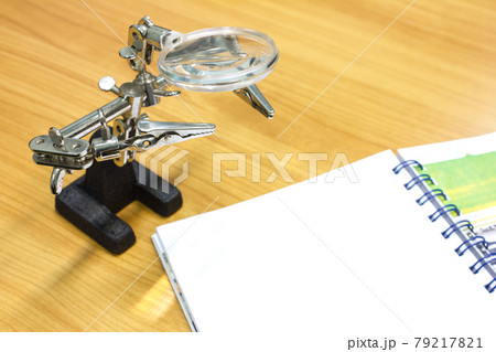 Lens scope on wood table Lens scope on wood table 79217821