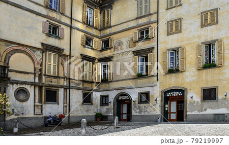 Bergamo/Italy - July 15, 2016: Traditional italian restaurant (Trattoria) in a old building of Bergamo, Upper City, famous tourist destination in Lombardy, Italy. Bergamo/Italy - July 15, 2016: Traditional italian restaurant (Trattoria) in a old building of Bergamo, Upper City, famous tourist destination in Lombardy, Italy. 79219997