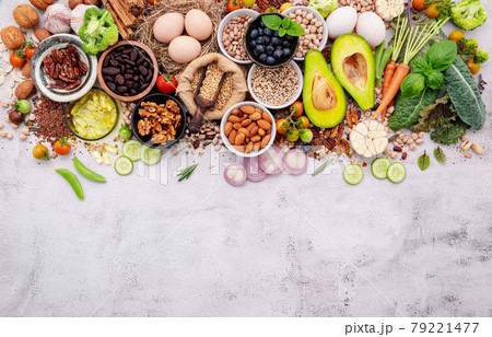 Ingredients for the healthy foods selection. The concept of superfoods set up on white shabby concrete background with copy space. Ingredients for the healthy foods selection. The concept of superfoods set up on white shabby concrete background with copy space. 79221477