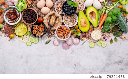 Ingredients for the healthy foods selection. The concept of superfoods set up on white shabby concrete background with copy space. Ingredients for the healthy foods selection. The concept of superfoods set up on white shabby concrete background with copy space. 79221478