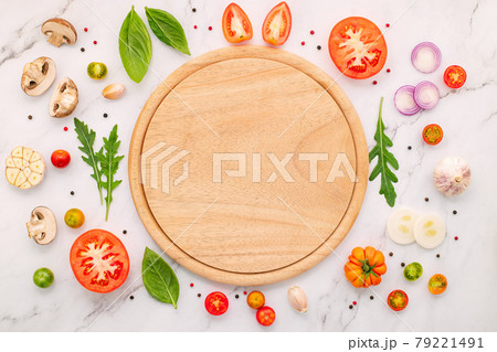The ingredients for homemade pizza set up on white marble background. 79221491