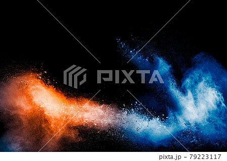 Orange blue color powder explosion on black background. 79223117