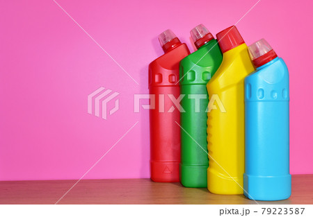 Detergent bottles on pink background. Detergents and laundry concept. Household  79223587