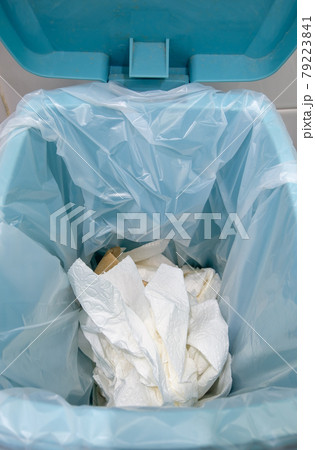 Closeup of the many used toilet paper in the plastic bag on the trashcan. Closeup of the many used toilet paper in the plastic bag on the trashcan. 79223841