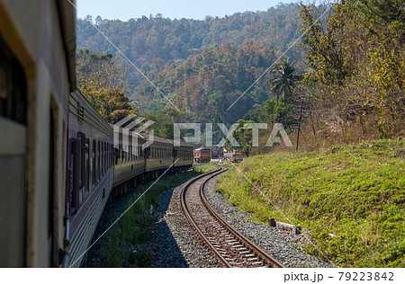 View from the rear of a special express train that leaves from the small station. View from the rear of a special express train that leaves from the small station. 79223842