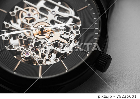 Skeleton wrist watch with black clock face, macro photo 79225601